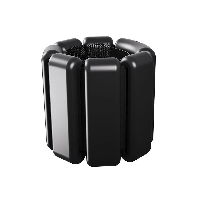 Black detachable silicone weight bracelet with Velcro fastener and a 2lb weight pod.