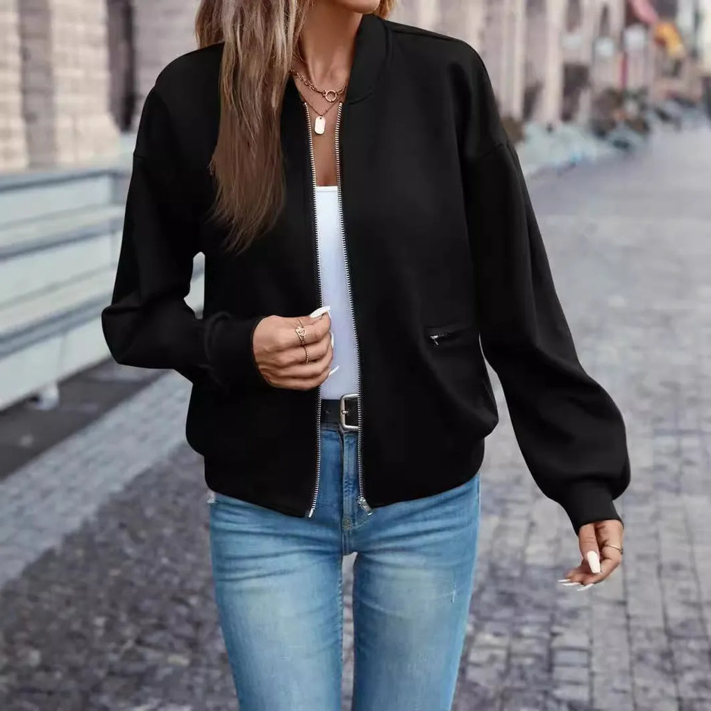Solid black women's zip jacket with long sleeves and faux pocket details on front.