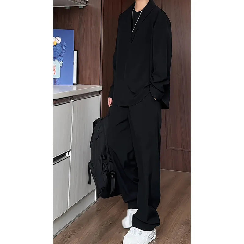 Men's black slim fit long sleeve polo shirt and matching trousers casual two-piece set.