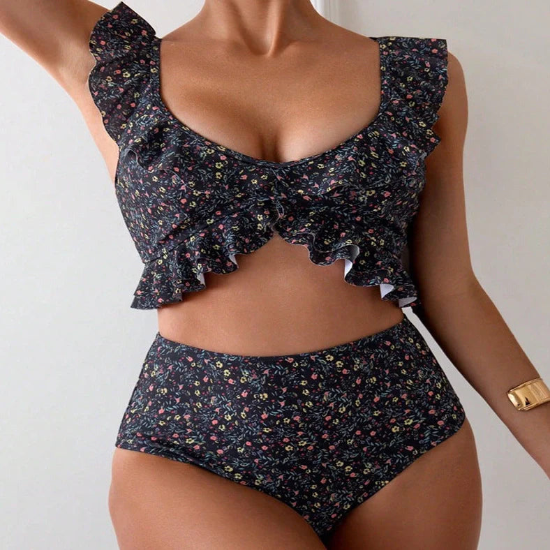 Women's backless floral print split swimsuit with pink, green, blue, purple flowers on black background