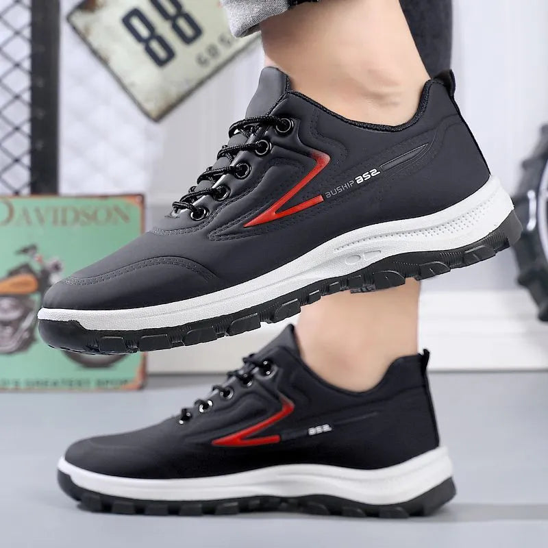 Waterproof leisure sports shoes in black and grey colour with artificial PU upper and plastic sole