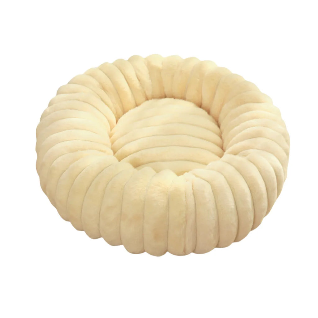 Round long-haired plush pet bed for dogs and cats, shown in beige, with size chart showing S, M, L, XL, XXL, XXXL options.