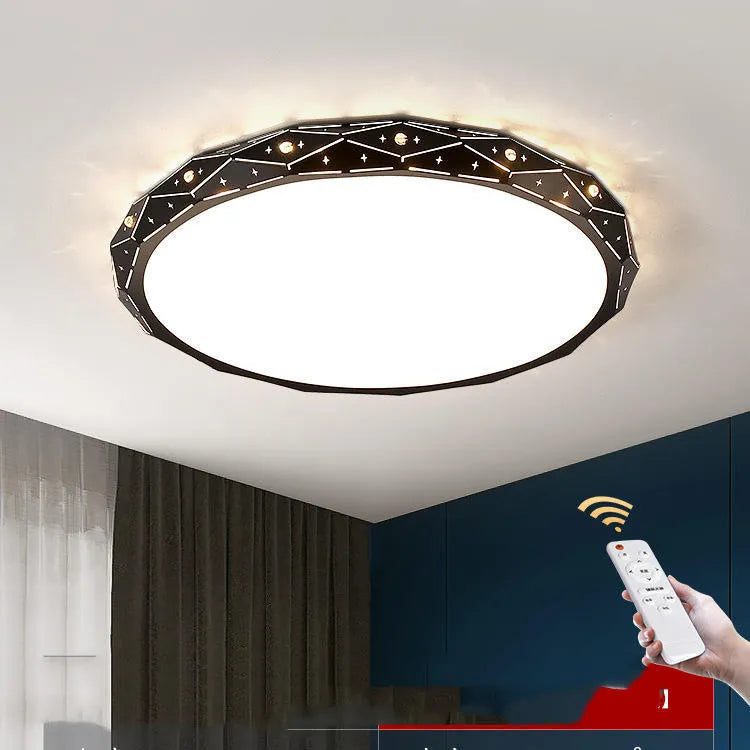Round black iron frame LED ceiling light with dimming control on a white ceiling