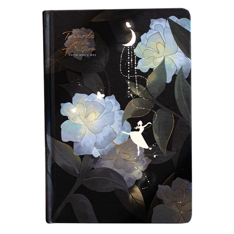 A5 notebook with luminous cover open to show colour illustration inside, in deep blue colour option.