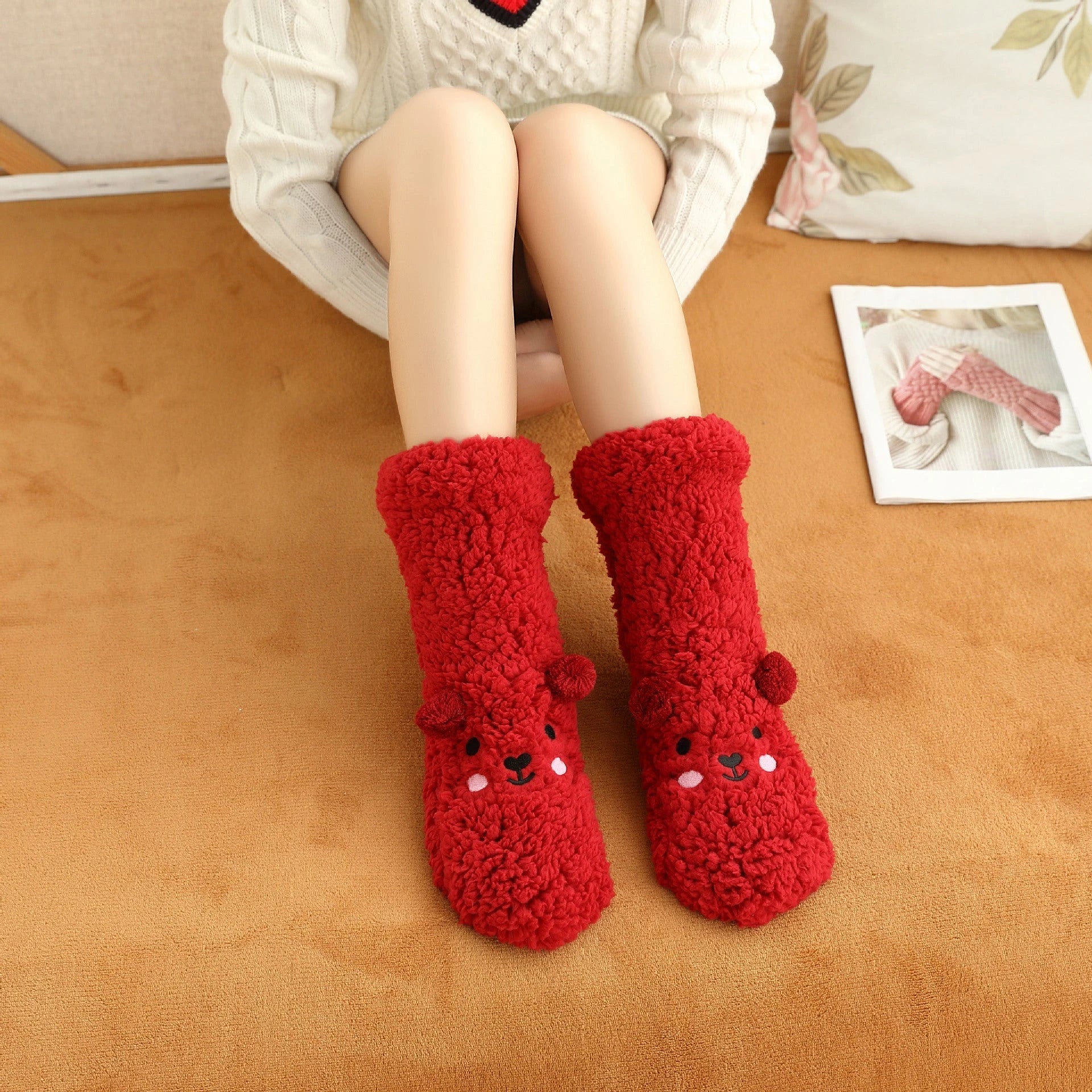 Cozy coral fleece socks in various colors, featuring a plush, insulating texture and non-slip grippy sole for comfortable home wear.