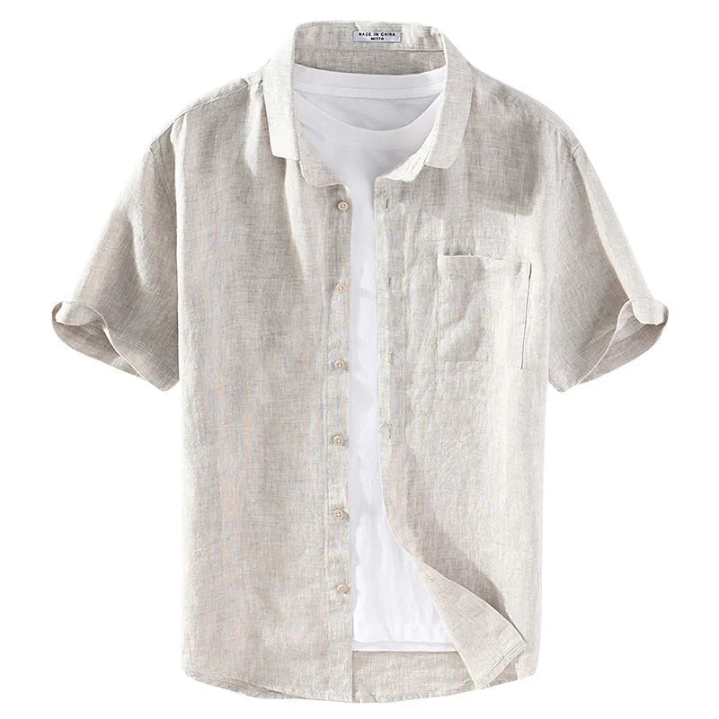 Men's short sleeve linen shirt with square collar in raw jute colour, laid flat.