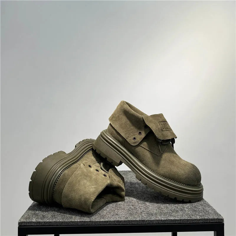Men's distressed brown cow suede worker ankle boots with thick rubber soles and visible stitching.