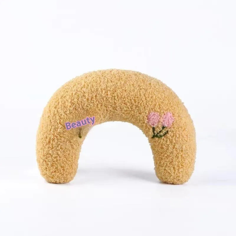 Blue U-shaped cat pillow bed in a Question Mark style on a white background