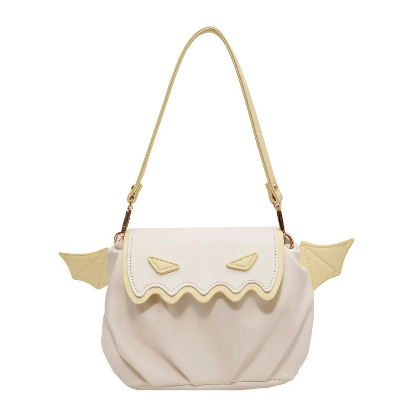 Halloween pumpkin cartoon crossbody bag with wings in black, white, and orange