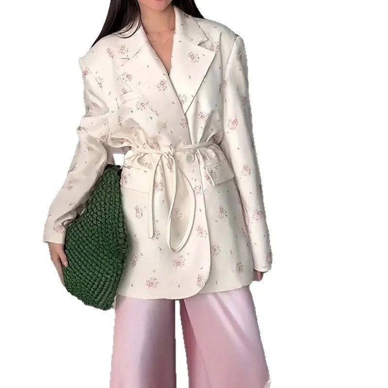 Women's collar lace-up waist-tight suit jacket in polyester, showing front tie detail on a model.