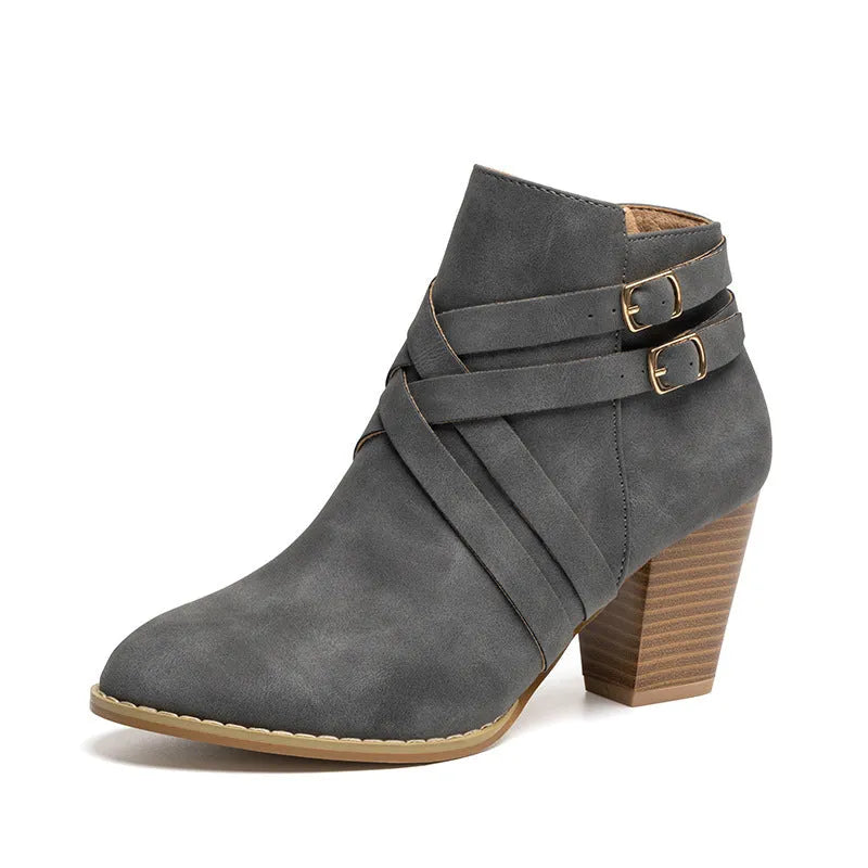 Women's grey ankle boot with 7cm block heel, side zipper, and buckle detail on a plain toe.