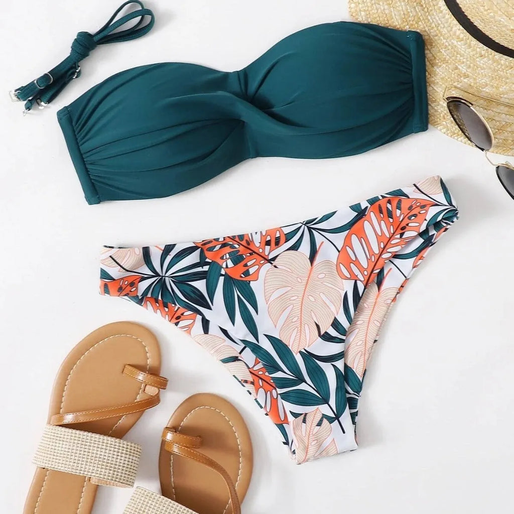 Split push up bikini swimsuit set in green on a mannequin, showing top and briefs style.