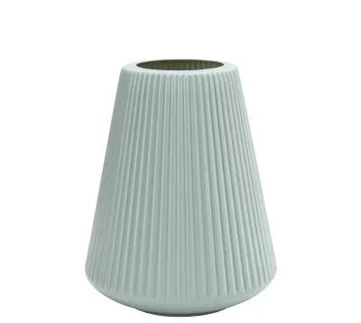 Colourful melamine plastic decorative flower vase on a desk, showing white, pink, green, and blue colour options.
