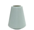 Colourful melamine plastic decorative flower vase on a desk, showing white, pink, green, and blue colour options.