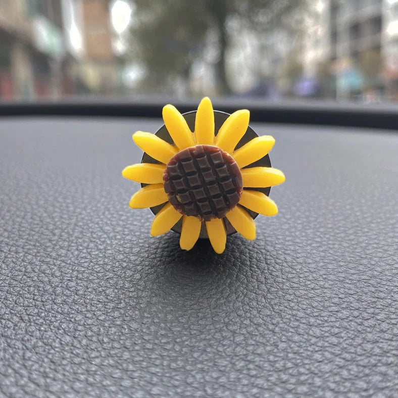 Yellow sunflower car vent perfume clip measuring 8cm with secure mounting clip for air freshening