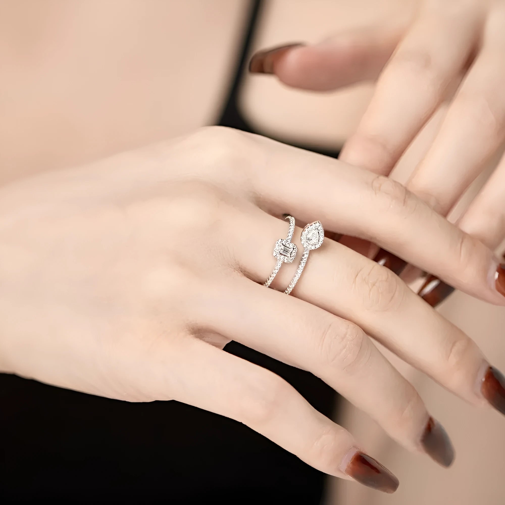 S925 sterling silver water drop double-layer hollow ring platinum finish geometric design on white background