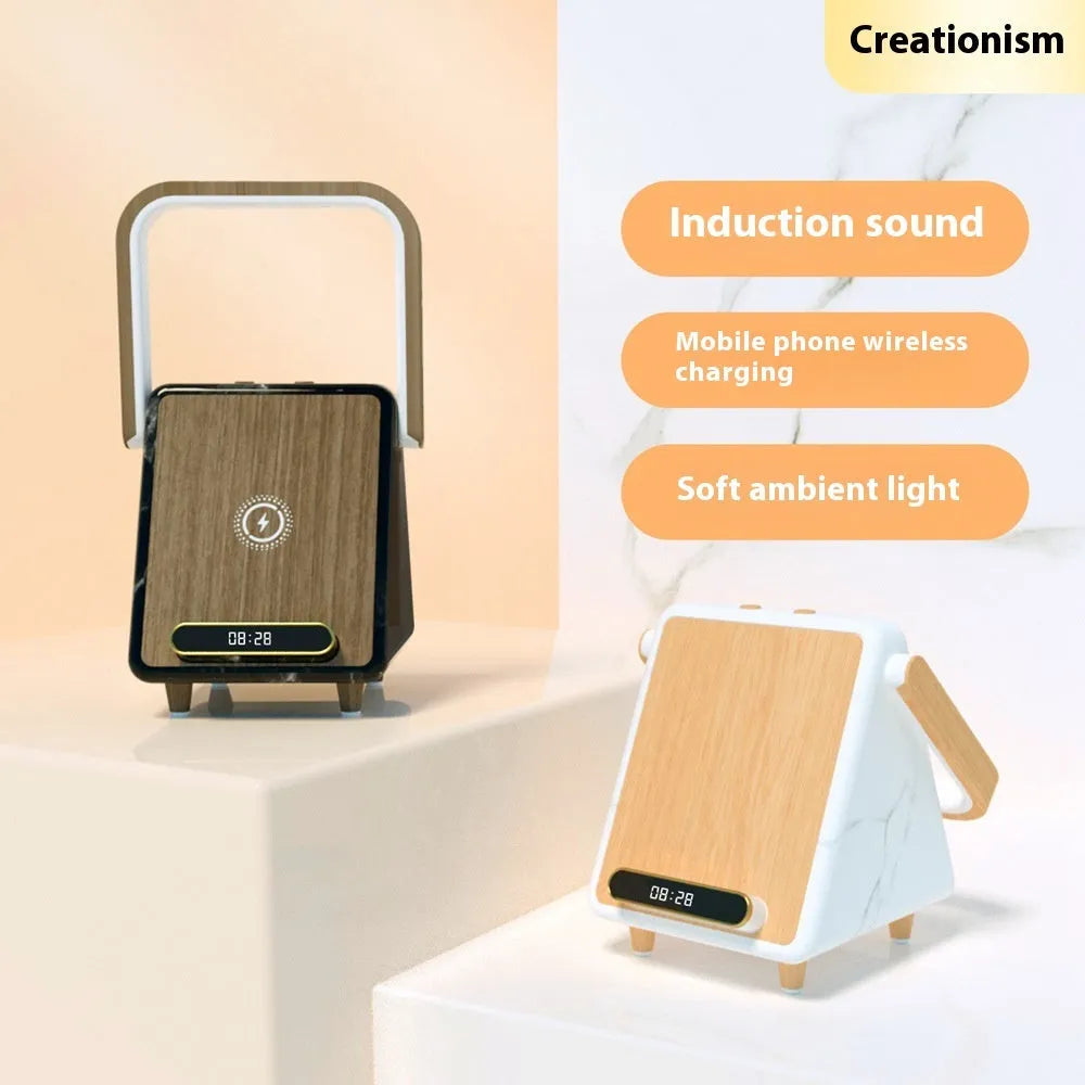 Wireless charging induction Bluetooth speaker small night lamp in Platinum Jazz finish with USB cable on a wooden desk