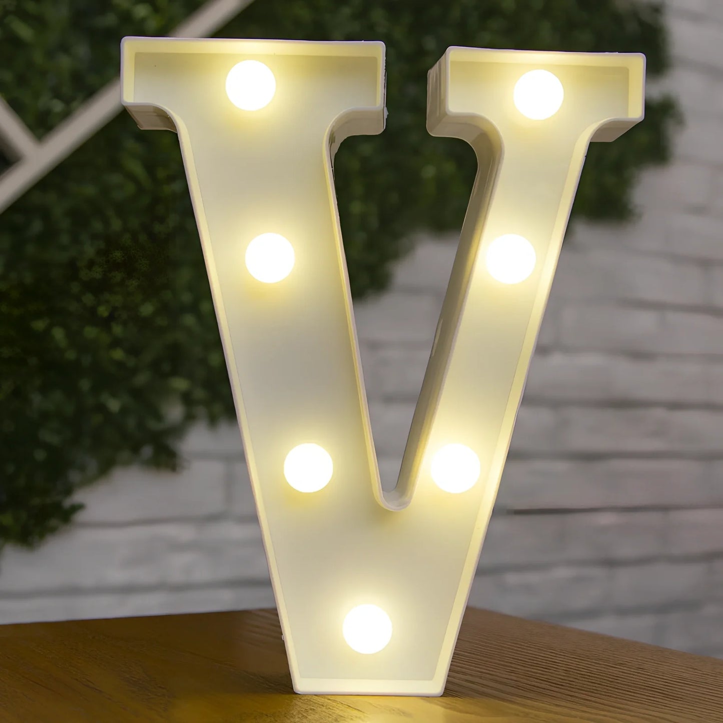 White plastic LED alphabet marquee sign with warm white illumination, 22cm height with battery operation