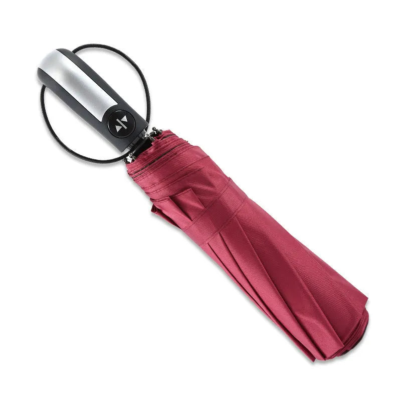 Black triple-folding automatic business umbrella with 10 ribs, shown open.