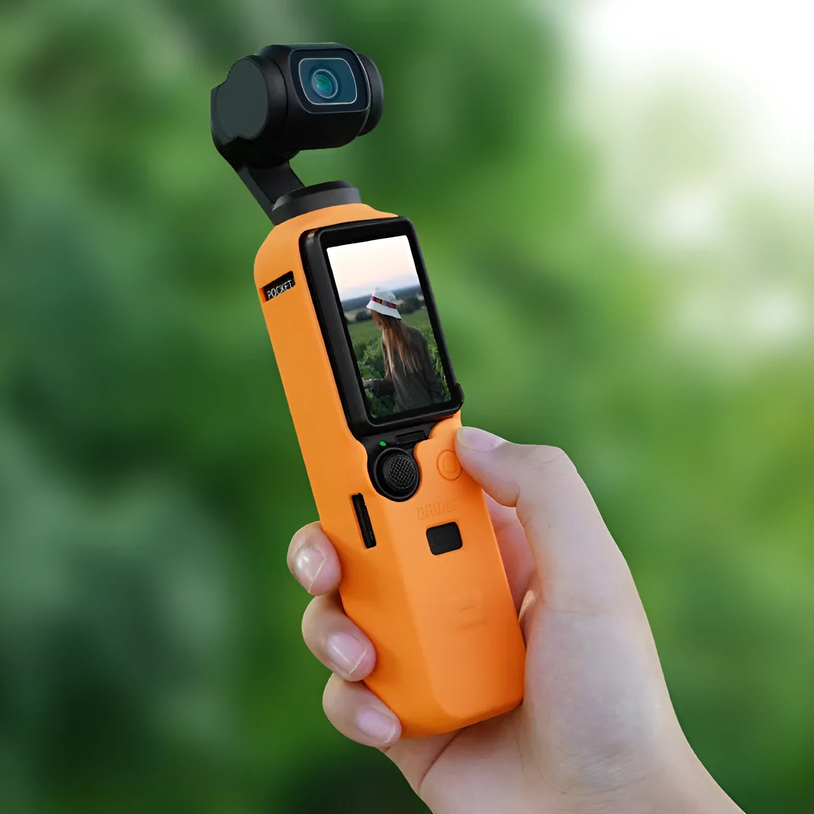 Silicone protective cover for camera body in black, red, and orange colours showing non-slip texture