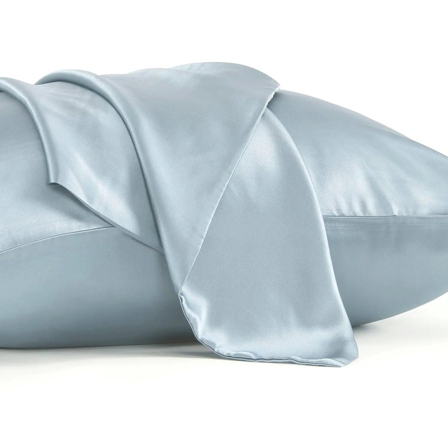 Dark grey mulberry silk pillowcase with envelope closure, shown in a modern bedroom setting.