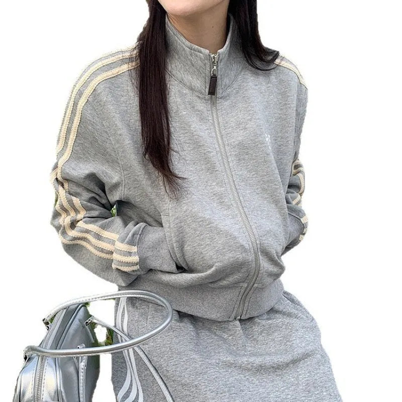 Women's retro baseball jacket in slim fit polyester with front pockets, available in navy blue or gray