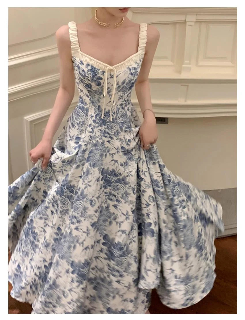 Retro women's floral strap dress in navy blue with high waist and A-line skirt