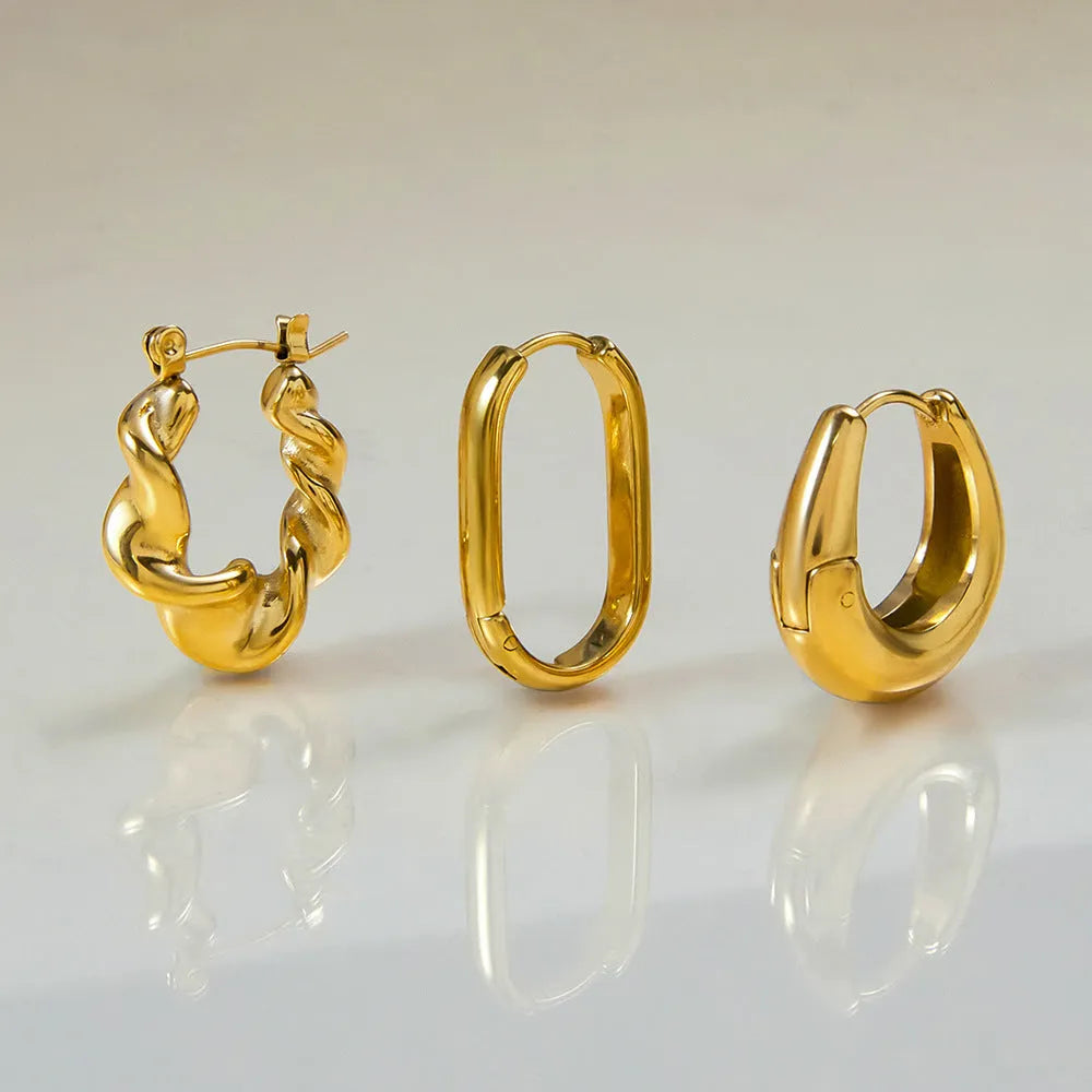 18K gold titanium steel geometric ellipse ear clip for women, light luxury style, on a model