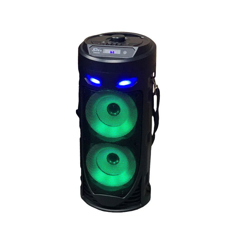 Black portable Bluetooth speaker with dual horn cannon design showing USB charging port and compact dimensions