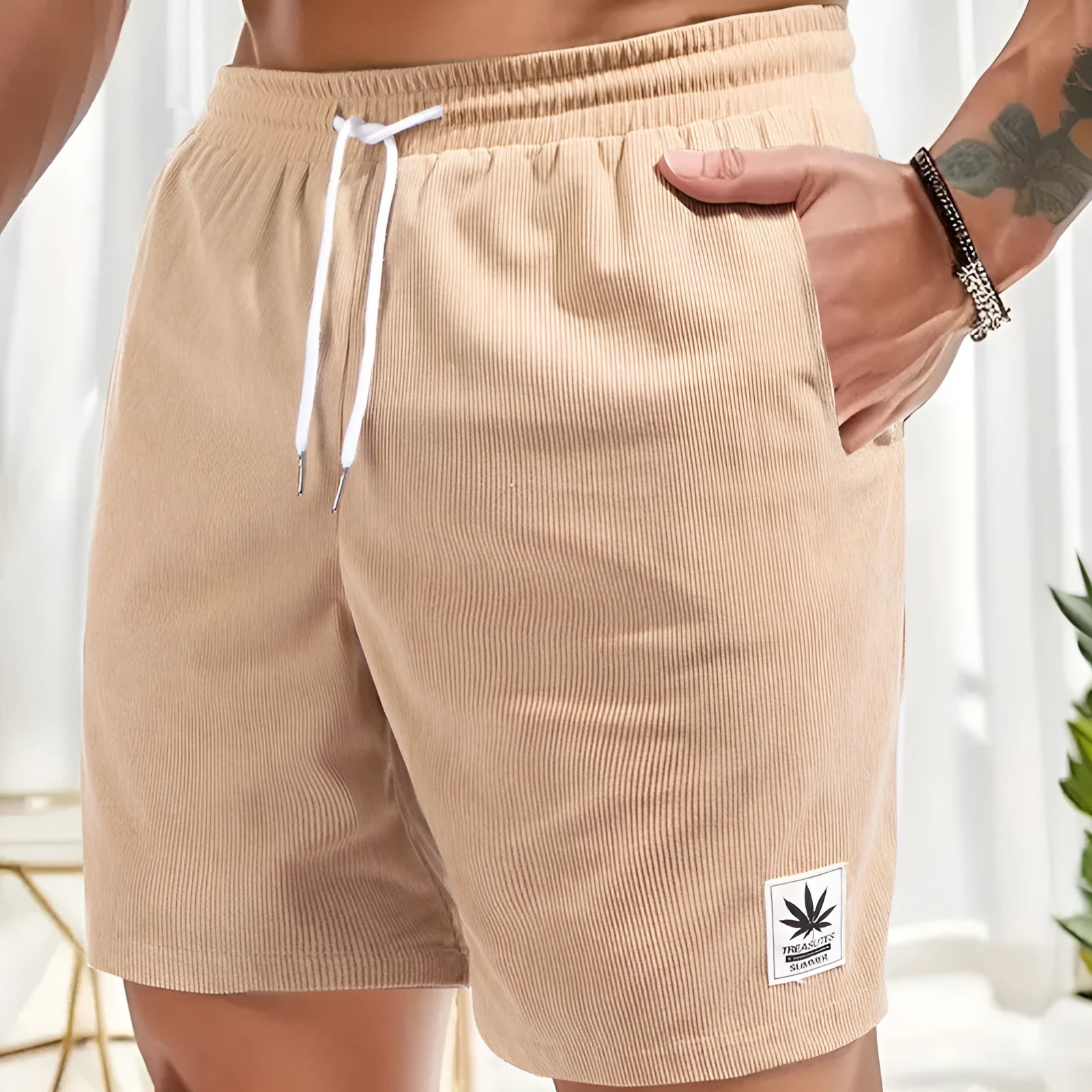 Men's grey drawstring summer leisure shorts on a white background.