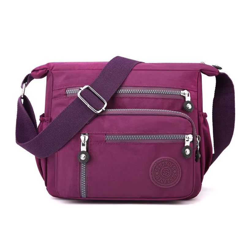 Lightweight grey nylon shoulder messenger bag with a single strap, shown in a square vertical shape.