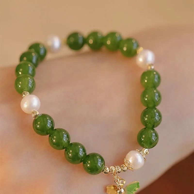 Natural green chalcedony gemstone bracelet with round beads in a minority design style for women.