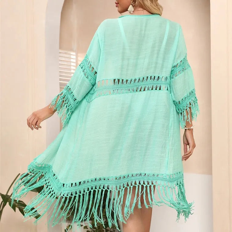 Hand-crocheted women's beach cover-up cardigan with tassel trim in acrylic fabric