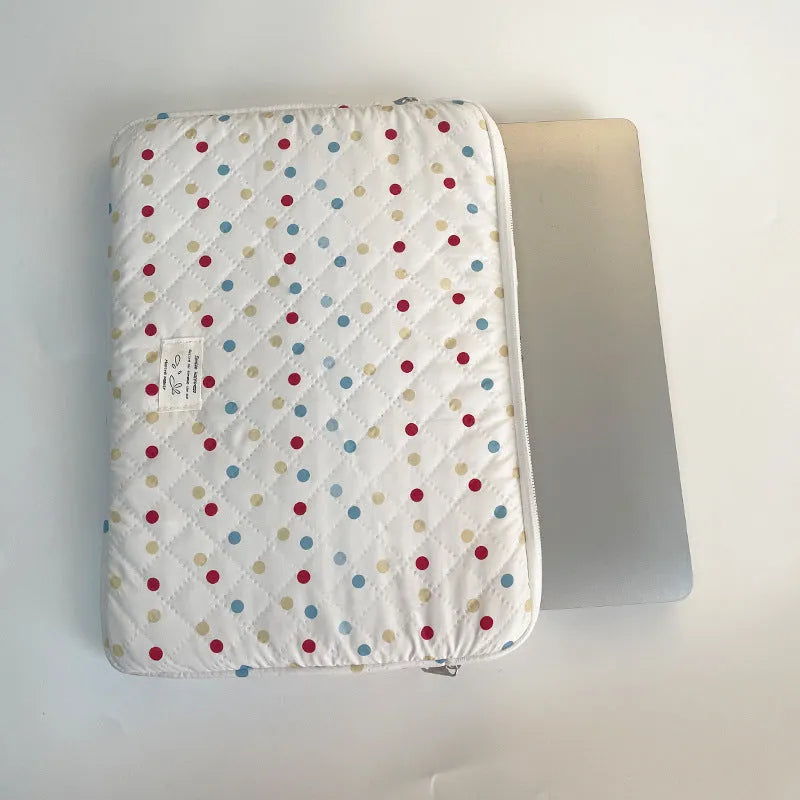 Women's polka dot polyester laptop bag shown in a solid colour, suitable for a 15.6 inch device.