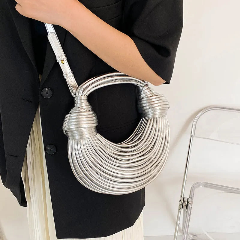 Instafamous Metal Noodles Underarm Bag with shiny metallic surface, chain detail, in gold colour