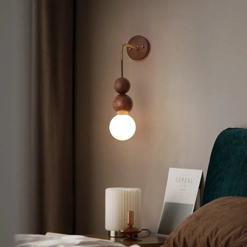 Wood and copper wall lamp with lollipop shade and tri-colour light for bedside or living room.