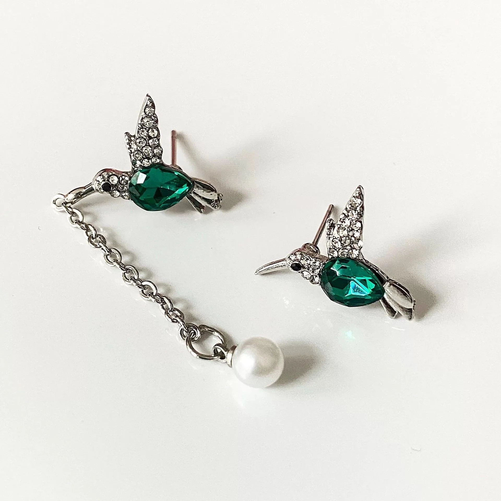 Hummingbird diamond pendant earrings with water droplet design in silver and green