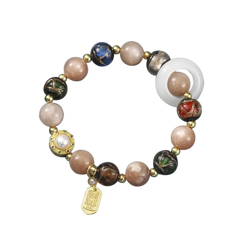 Hand-woven bracelet with fragrant grey coloured glaze, sunstone beads and white lip shell beads