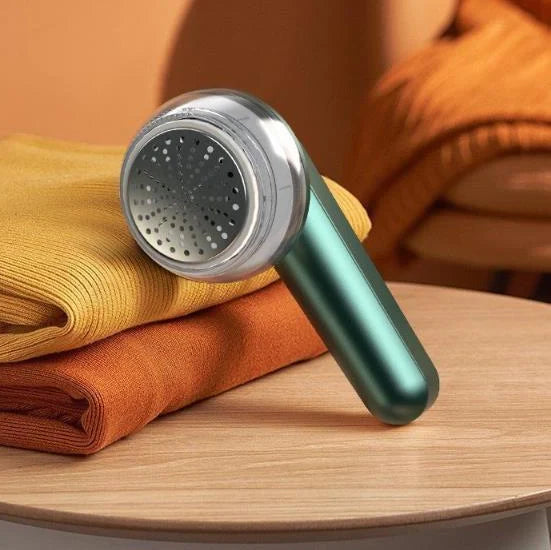 Green and white USB-powered fabric shaver device for removing pilling from clothing