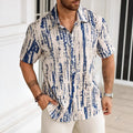 Man wearing a blue striped short sleeve casual shirt with 3D printing detail.