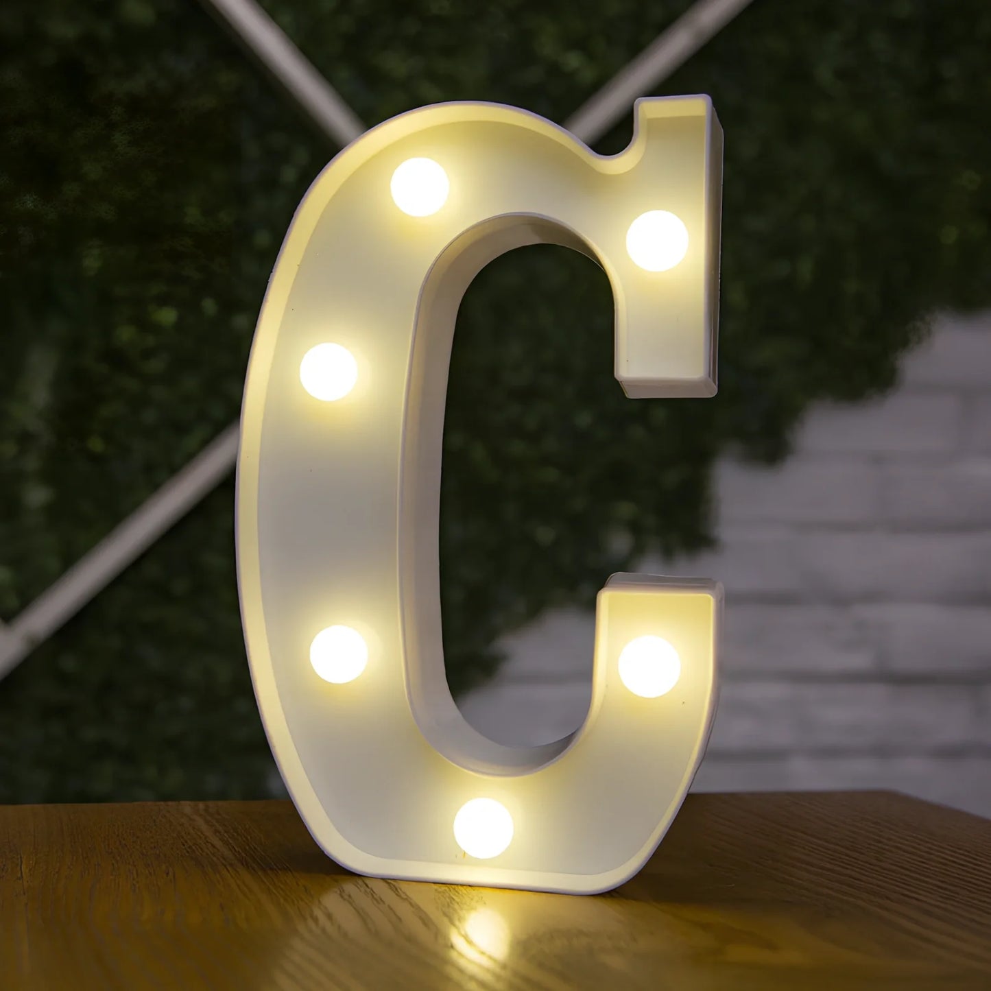 White plastic LED alphabet marquee sign with warm white illumination, 22cm height with battery operation