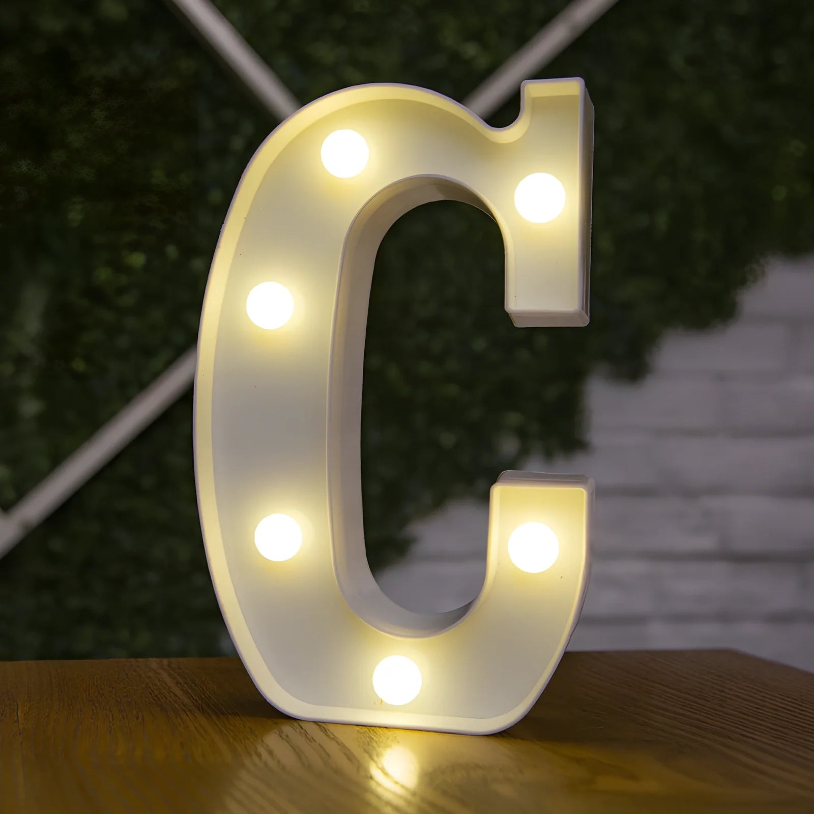 White plastic LED alphabet marquee sign with warm white illumination, 22cm height with battery operation