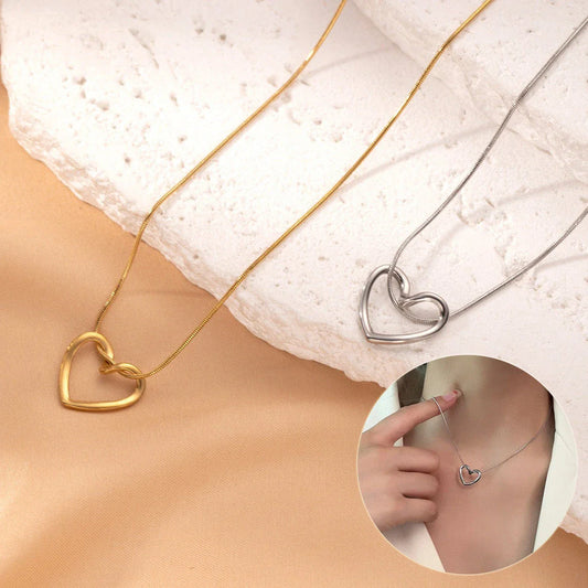 Stylish titanium steel twist pendant necklace with a hollow heart-shaped design, available in gold and silver colors