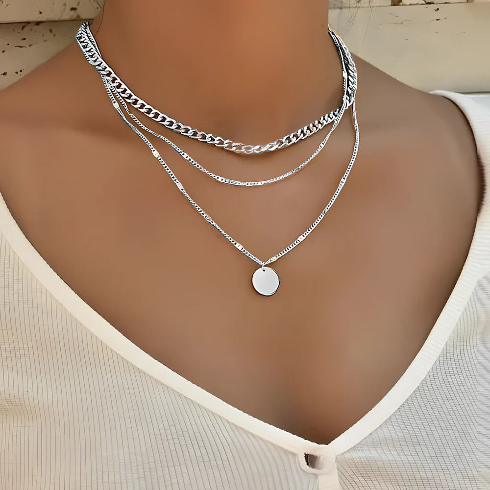 Women's multilayer alloy necklace with 2.5 cm disc pendant on 40-50 cm electroplated chains in gold or silver