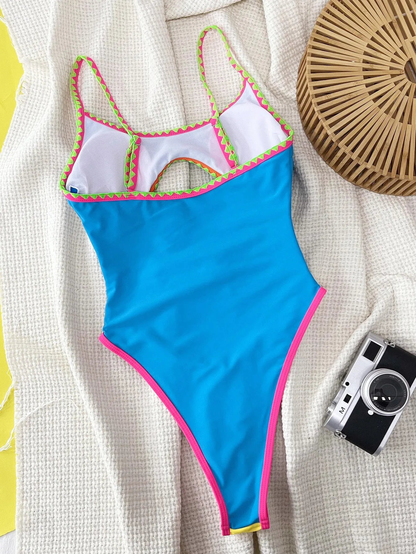 Women's blue nylon one-piece swimsuit with contrast colour hollow strap design for swimming and wading