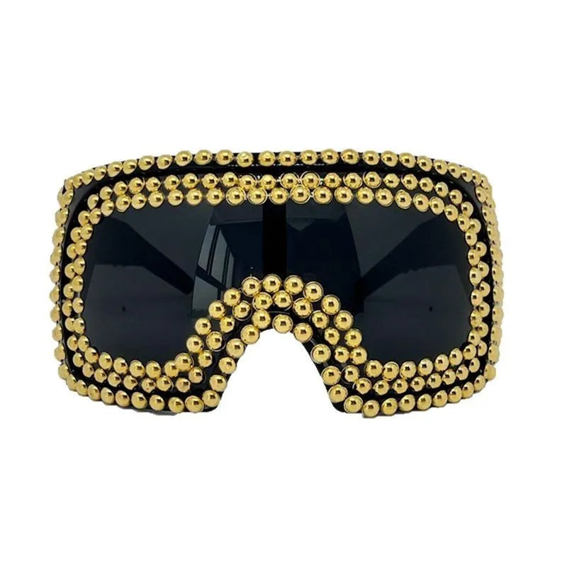 Men's punk-style sunglasses with large square silver frames and prominent rivet details.
