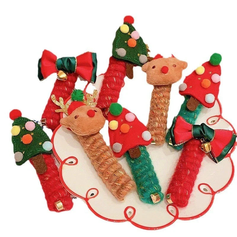 Festive Christmas hair ties for girls in various holiday-themed designs, including red bells, green trees, and khaki deer.