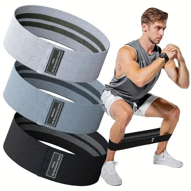 Cloth-covered nylon resistance band in light gray on a gym floor