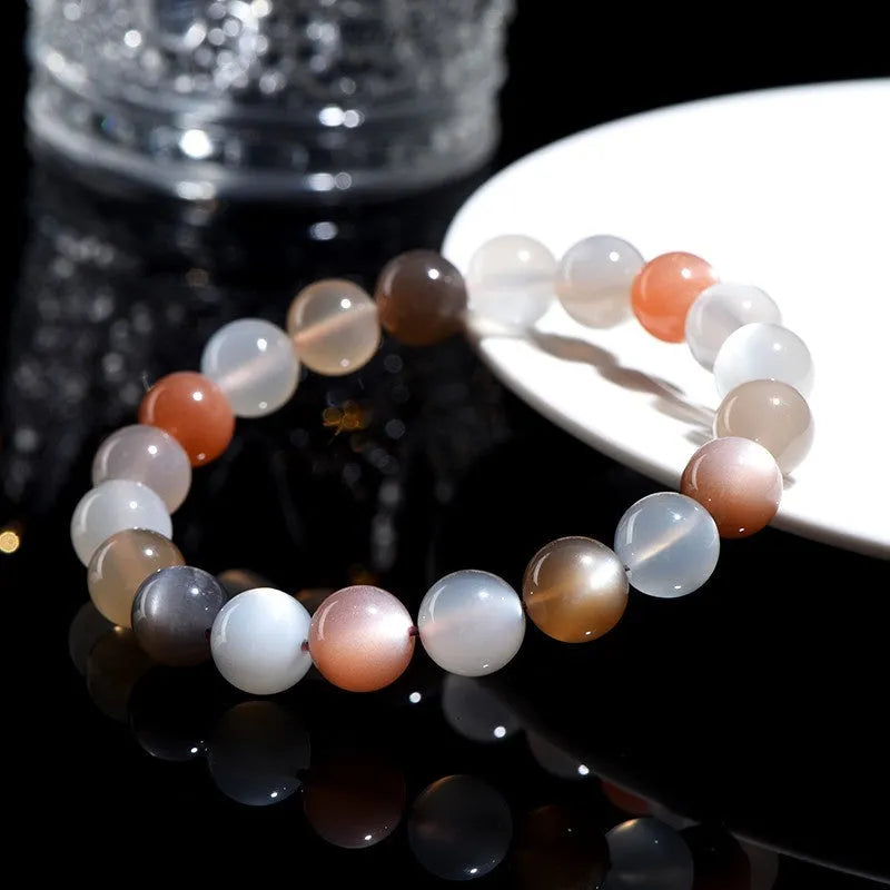 Natural colourful moonlight moonstone duobao bracelet with 8mm beads on a wrist.