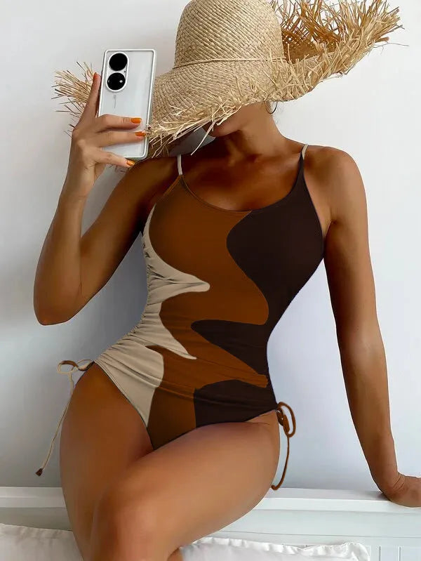 Blue sleeveless backless one-piece swimsuit for women on a mannequin, showing the tight-fitting striped design.